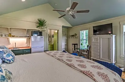 a bedroom with a bed and a ceiling fan at Tropical Studio quarter Mi to Public Beach Access! in Santa Rosa Beach