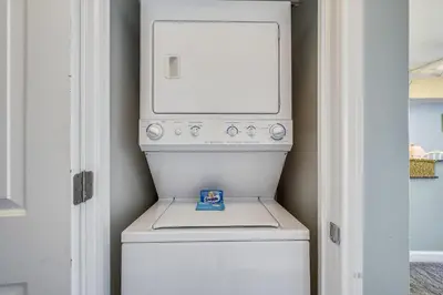 a white washer and dryer in a room at Shores of Panama #1725 at Book That Condo in Panama City Beach