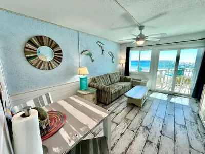 a living room with a couch and a table at Blue Haven Villa in Panama City Beach