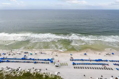 an aerial view of a beach with chairs and umbrellas at Splash Beach Resort #1601-W by Book That Condo in Panama City Beach