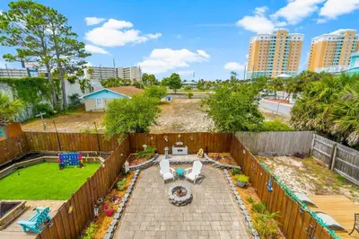 an aerial view of a backyard with a fence at Basking by the Beach in Panama City Beach