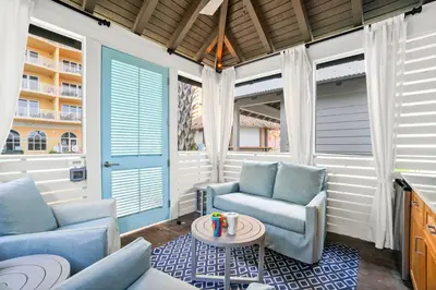 a living room with two chairs and a table at Calypso Resort Tower 3 by Panhandle Getaways in Panama City Beach