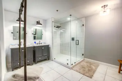 a bathroom with a glass shower and a sink at BRAND NEW! Laketown Wharf 633! Amazing 3 BD, Great Location, And Awesome Amenities! in Panama City Beach