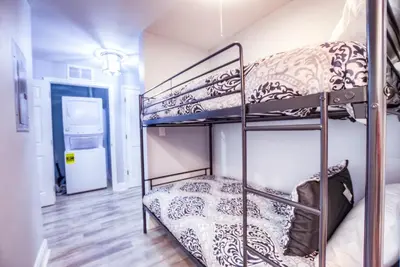 two bunk beds in a room with a hallway at BRAND NEW! Laketown Wharf 633! Amazing 3 BD, Great Location, And Awesome Amenities! in Panama City Beach
