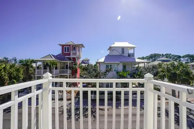 a white fence in front of some houses at 30A Beach House - Sunny Daze by Panhandle Getaways in Panama City Beach