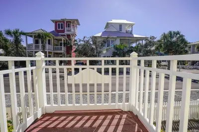 a white picket fence on a house at 30A Beach House - Sunny Daze by Panhandle Getaways in Panama City Beach