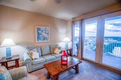 a living room with a couch and a table at Next To The 10th Floor Pool - Laketown Wharf 1032- 2 BD Plus Bunks, 2BA, And Amazing Amenities! in Panama City Beach