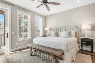 a bedroom with a bed and a ceiling fan at Rolling Dunes in Inlet Beach