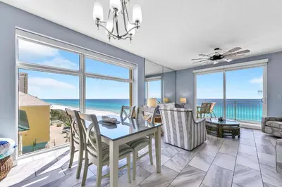 a dining room with a view of the ocean at Sterling Reef 401 in Panama City Beach