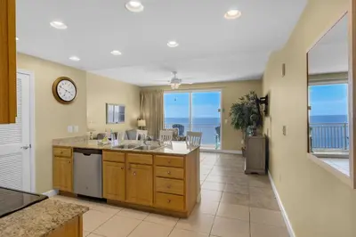 a large kitchen with a view of the ocean at Splash 1803E in Panama City Beach
