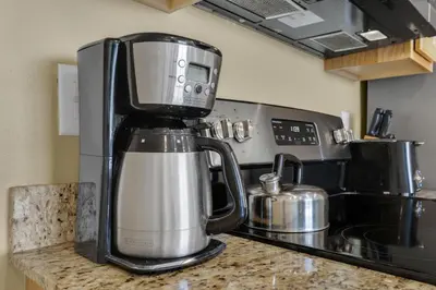a coffee maker sitting on top of a kitchen counter at Splash 1803E in Panama City Beach