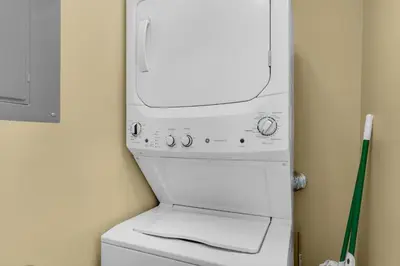 a washer and dryer sitting on top of a washing machine at Splash 1803E in Panama City Beach