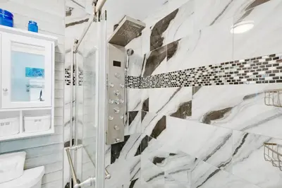 a bathroom with a shower and a toilet at Horizon South 74F in Panama City Beach