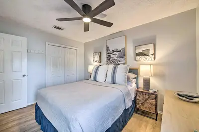 a bedroom with a bed with a ceiling fan at PCB Condo Rental with Pool Access, Steps to Beach! in Panama City Beach