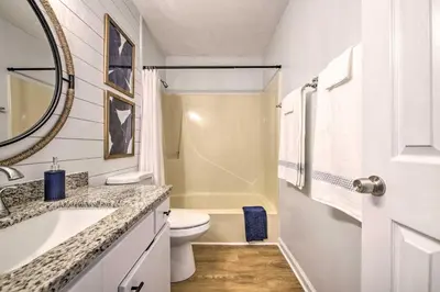 a white bathroom with a sink and a toilet at PCB Condo Rental with Pool Access, Steps to Beach! in Panama City Beach
