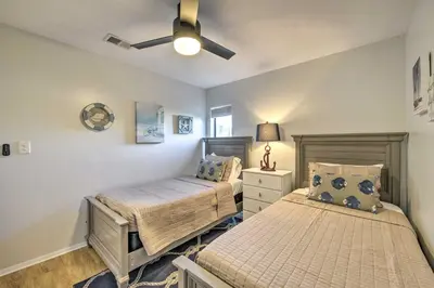 a bedroom with two beds and a ceiling fan at PCB Condo Rental with Pool Access, Steps to Beach! in Panama City Beach