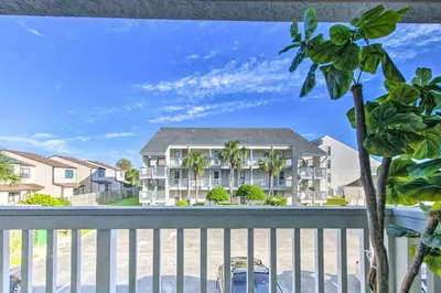 a view from the balcony of a condo at PCB Condo Rental with Pool Access, Steps to Beach! in Panama City Beach