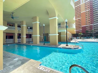 a swimming pool in the middle of a hotel at Calypso 3-2303 Penthouse Level w/ Incredible View! in Panama City Beach