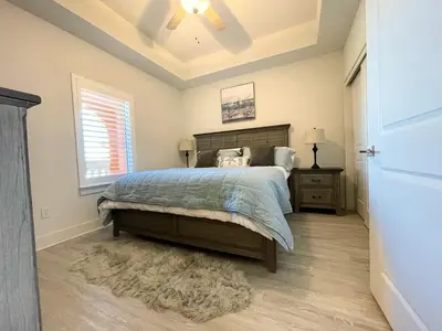 a bedroom with a bed and a window at Calypso 3-2303 Penthouse Level w/ Incredible View! in Panama City Beach