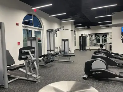 a gym with rows of treadms and cardio machines at Calypso 3-2303 Penthouse Level w/ Incredible View! in Panama City Beach