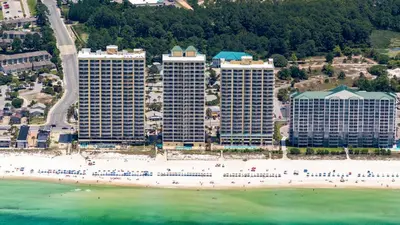 an aerial view of a beach with hotels and buildings at PARKING INCLUDED-Beachfront 2BD Ocean Villa! Gorgeous Amenities, Private Complex in Panama City Beach