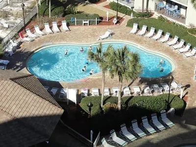 an overhead view of a pool with chairs and people in it at Summerhouse 502A in Panama City Beach