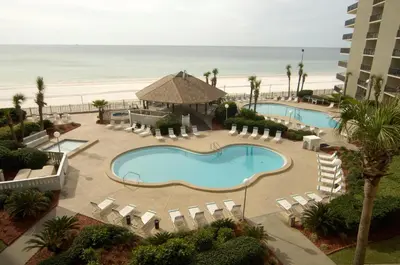 an aerial view of a resort with a swimming pool and the beach at Summerhouse 502A in Panama City Beach