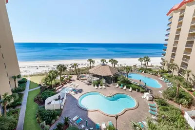 an aerial view of a resort with a pool and the beach at Summerhouse 502A in Panama City Beach
