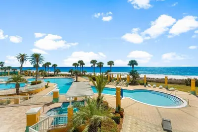 a resort with a swimming pool and the beach at En Soleil Beach Resort by Panhandle Getaways in Panama City Beach
