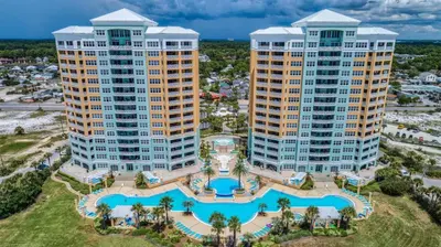 an aerial view of three tall buildings with a pool at En Soleil Beach Resort by Panhandle Getaways in Panama City Beach