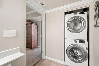 a laundry room with a washer and dryer at Summer By The Sea Unit 2203 in Panama City Beach