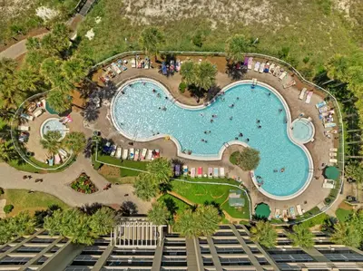 an overhead view of a swimming pool at a resort at Grand Panama Beach Resort by Panhandle Getaways in Panama City Beach