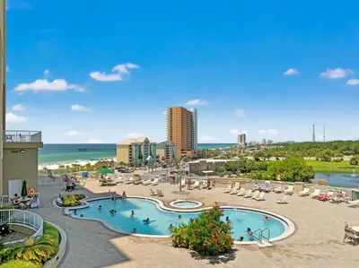 a resort with a swimming pool and a beach at Grand Panama Beach Resort by Panhandle Getaways in Panama City Beach