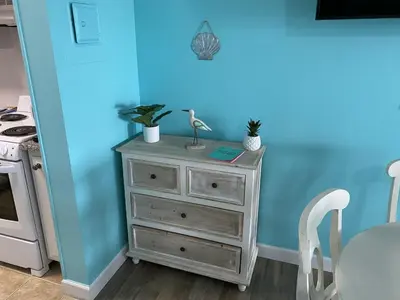 a dresser with two plants on top of it at Lullwater Condos 291 in Panama City Beach