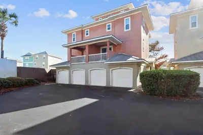 a large house with a driveway in front of it at Sunny Side Up by Book That Condo in Panama City Beach