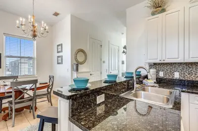 a kitchen with a sink and a counter top at Sunny Side Up by Book That Condo in Panama City Beach