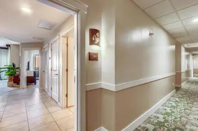 a hallway in a building with a hallway at Origin at Seahaven #831 by Book That Condo in Panama City Beach