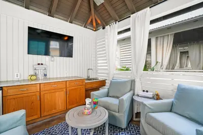 a living room with two chairs and a table at Calypso Resort Tower 3 by Panhandle Getaways in Panama City Beach