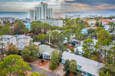 an aerial view of a city with buildings and trees at A Wave From It All in Santa Rosa Beach