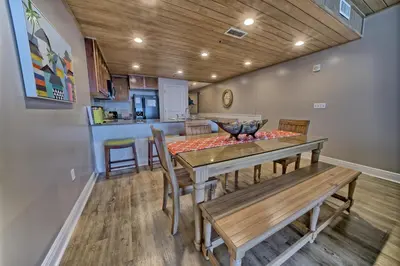 a kitchen and dining room with a table and chairs at Sterling Breeze - Luxury Beach Front Condo in Panama City Beach
