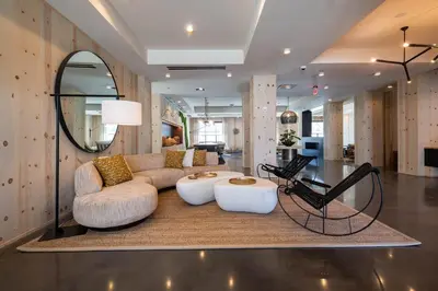 a living room with a couch and a table at The Lodge 30A in Santa Rosa Beach