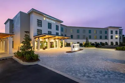 a large building with a parking lot in front of it at The Lodge 30A in Santa Rosa Beach
