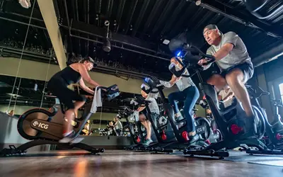 a group of people on bikes in a gym at Camp Creek Inn in Seacrest