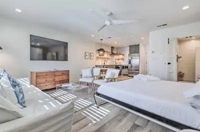 a bedroom with a bed and a living room at Santa Rosa Beach Studio Condo Less Than 1 Mi to Beach in Santa Rosa Beach