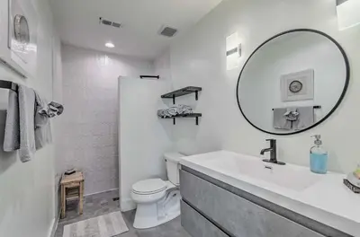 a white bathroom with a sink and a mirror at Santa Rosa Beach Studio Condo Less Than 1 Mi to Beach in Santa Rosa Beach