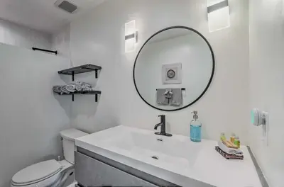 a white bathroom with a sink and a mirror at Santa Rosa Beach Studio Condo Less Than 1 Mi to Beach in Santa Rosa Beach