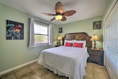 a bedroom with a bed and a ceiling fan at The Sage PCB Family Getaway - Walk to Beach! in Panama City Beach