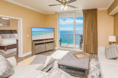 a living room with a view of the ocean at Tidewater2808 in Panama City Beach