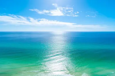 a view of the ocean with a blue sky and clouds at Tidewater2808 in Panama City Beach
