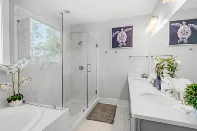 a white bathroom with a shower and a tub and a sink at Last Call at NatureWalk 30A in Seagrove Beach